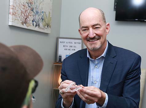 Dr. Kent Smith working with patient