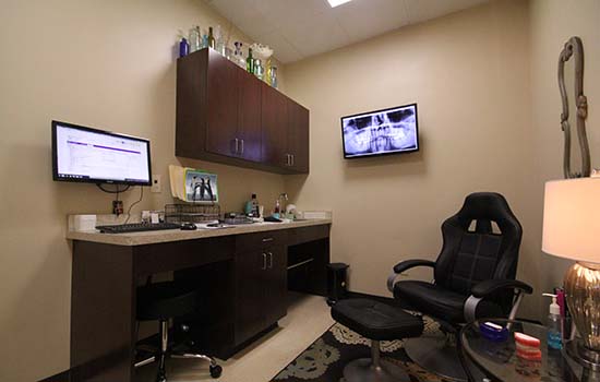 comfortable exam room with a computer monitor