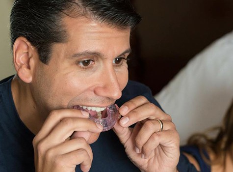 Man putting in oral appliance