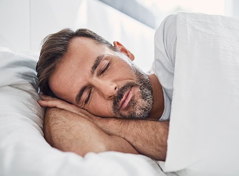 Man sleeping in bed