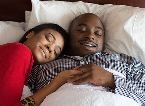 man sleeping with oral appliance peacefully