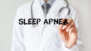 doctor writing out sleep apnea