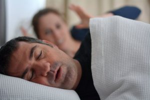 a woman who is concerned about her partner's snoring