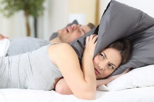 sleep apnea interrupting a woman's sleep