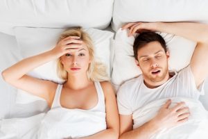 woman frustrated at her partner's little snoring
