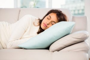 woman taking a nap on a couch