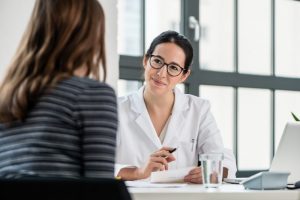 woman with sleep problems talking to a sleep doctor