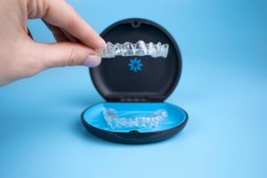 hand holding an Invisalign aligner