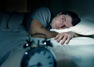 man awake with insomnia