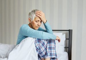 woman with a headache after waking up