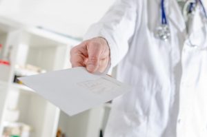doctor holding a letter