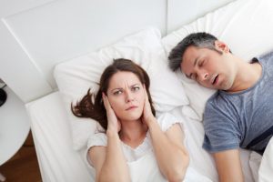 woman awake from spouse snoring